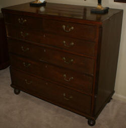 Empire flame mahogany period chest with glass knobs