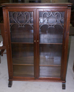 two door walnut antique bookcase with lattice work doors