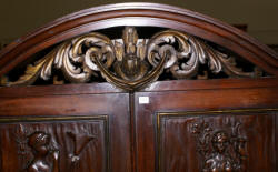 walnut heavily carved antique blind door crystal cabinet with built in butlers desk