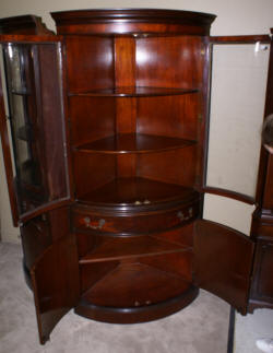 bow front mahogany corner cabinet