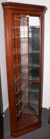 Petite mahogany finish corner curio cabinet by Pulaski Furniture Company
