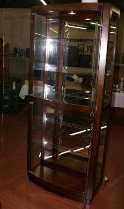 Bow front lighted glass/ mirrored curio cabinet