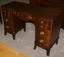 Urn inlaid mahogany kneehole desk
