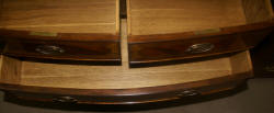 Heavily inlaid mahogany bow front dresser