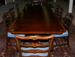Banded inlaid modern mahogany dining room table with a set of 8 1940s ribbon back solid mahogany dining room chairs