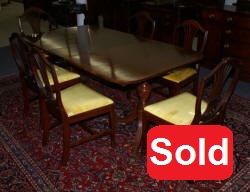 Mahogany banded inlaid Duncan Phyfe dining room table and set of six shield back dining room chairs