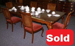 solid cherry table and six cane back chairs
