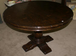 Jonathan Charles round extending oak dining room table