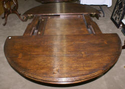 Jonathan Charles round extending oak dining room table