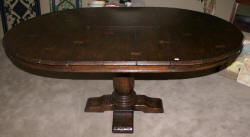 Jonathan Charles round extending oak dining room table